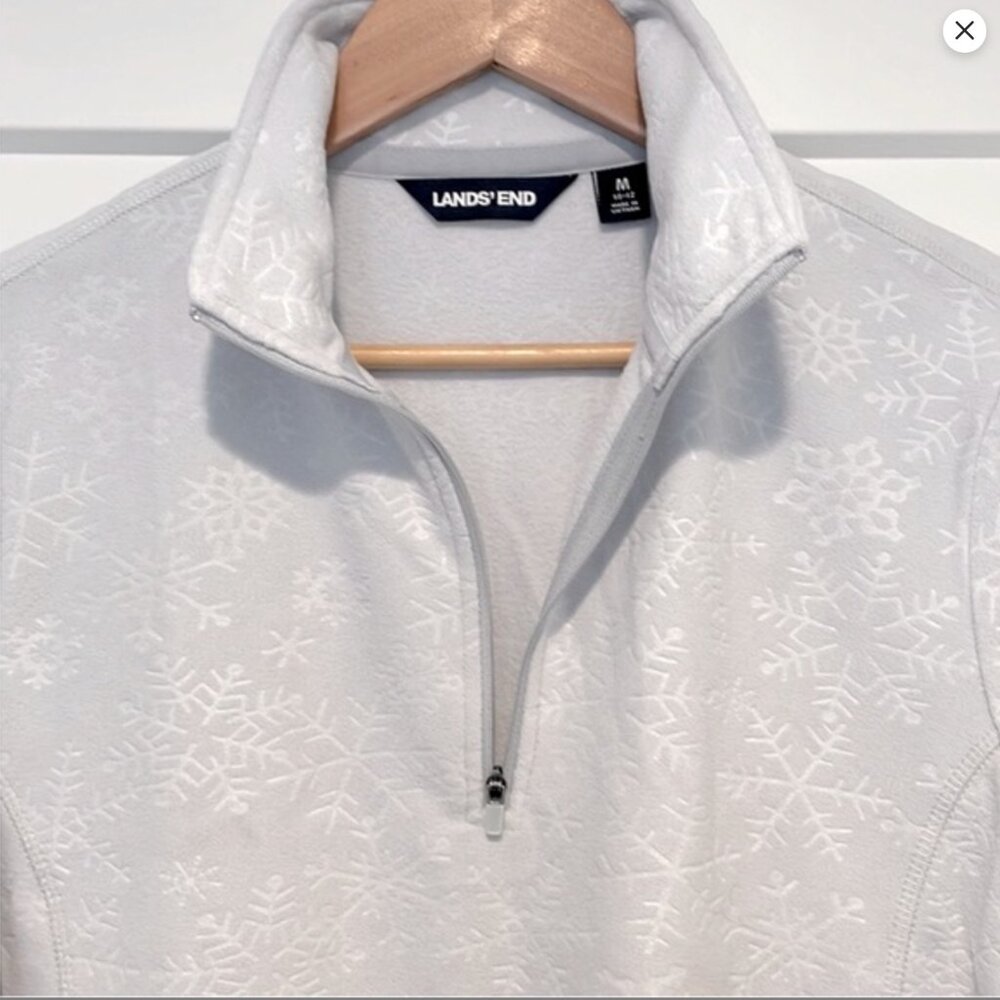 Lands’ End quarter 1/4 zip fleece snowflakes size M 10-12. Like new condition!
